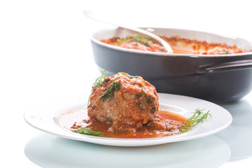 meatballs with tomato sauce on a white background