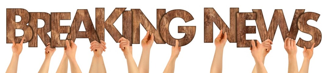 BREAKING NEWS people holding up wooden wood oak rustic wooden letters isolated on white background...