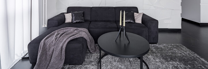 Black furniture in modern apartment