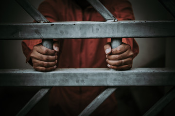 Hands of men desperate to catch the iron prison,prisoner concept,thailand people,Hope to be free,A...