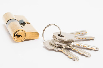 door lock cylinder with bunch of keys on white background