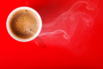 Tuinposter Fragrant coffee on a red background for your advertising. Smoke from hot coffee. © ninell
