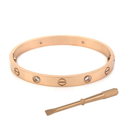 Obraz premium Fashion golden bracelet with screwdriver isolated on white