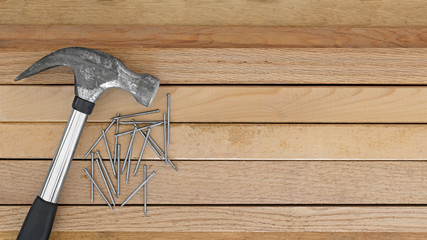 Hammer nails wood background