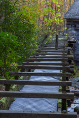 Wood sluice leading up to an old mill, Great Smoky Mountains, vertical aspect