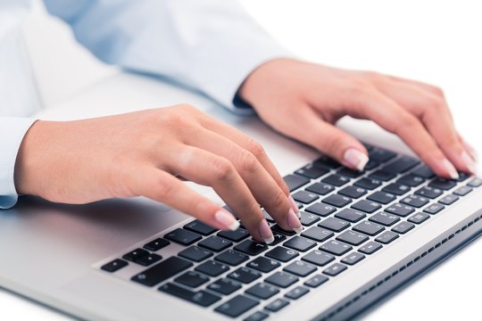 Closeup of a Businesswoman Typing on a Laptop