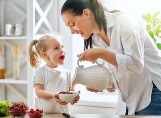 Happy family having breakfast.