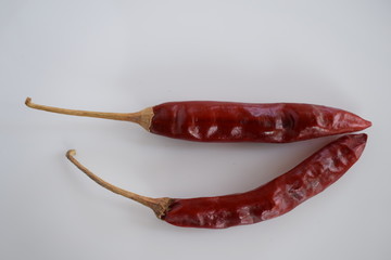 Dried red chili or chilli cayenne pepper isolated on white background 