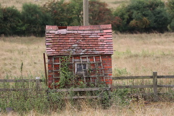 old pump hose beside the canal 