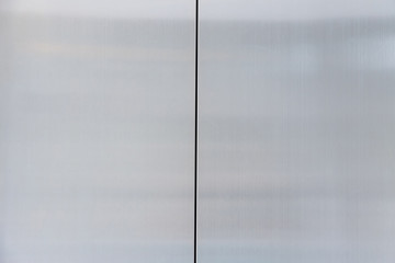 close stainless steel of elevator door. silver metal wall background and texture.