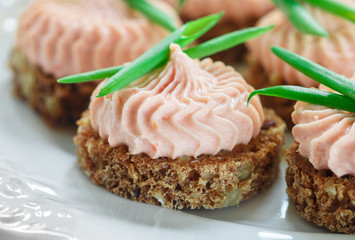Delicious mousse of Smoked Salmon, Cream Cheese and chives on Rye Bread Slices
