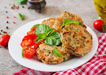 Spicy vegan burgers with rice, chickpeas and herbs. Salad tomato and basil. Vegetarian food.
