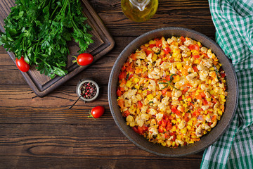 Mexican chilli from chicken with sweet pepper and corn. Chilli con carne. Mexican, Texan cuisine. Top view. Flat lay