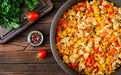 Mexican chilli from chicken with sweet pepper and corn. Chilli con carne. Mexican, Texan cuisine. Top view. Flat lay