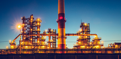 Fototapeta premium Oil refinery industrial plant or factory, storage distillery tanks and steel pipeline, modern petrochemical technologies