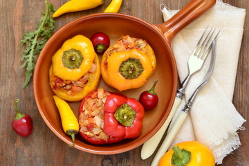Baked sweet peppers stuffed with vegetables, vegetarian meal