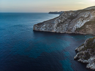 Summer 2018, Xabia, Javea, Valencia, Spain,Playa de la Granadella. Sunset view of cape rock formation wild Granadella beach. Panoramic aerial photo from drone.