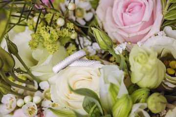White gold wedding rings on wedding flower