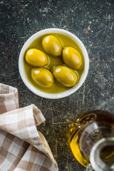 Green olives and olive oil.