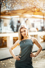 Fototapeta premium Blonde in dress and jewelry posing on Sarajevo streets