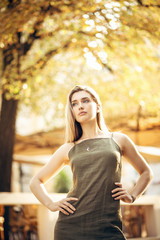Blonde in dress and jewelry posing on Sarajevo streets