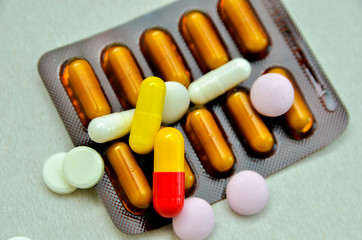 tablets are scattered on the table, dosage for the patient