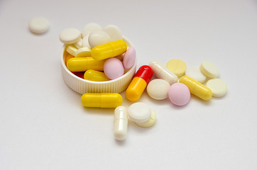 tablets are scattered on the table, dosage for the patient