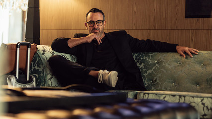 Entrepreneur in business trip waiting in hotel lobby