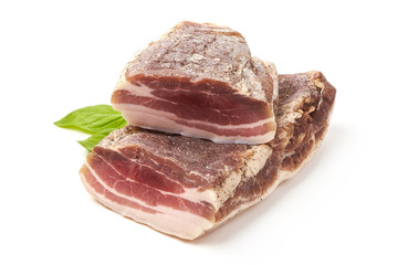 Smoked rustic farmer meat with basil leaves, isolated on white background.