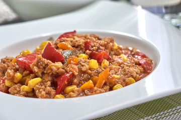 American food. Pasta alla genovese. Pasta with corn, fried meat and sauce.
