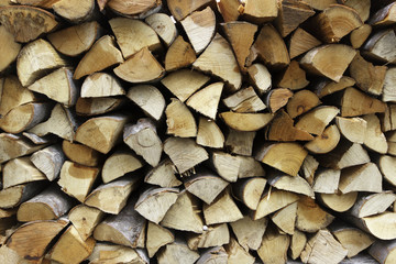 Dry chopped firewood logs backround texture