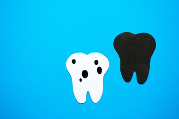 A sick tooth against a healthy background.