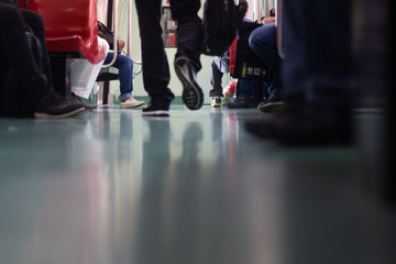 Person walking on subway train. Low angle