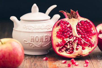 Rosh HaShanah Jewish New Year Composition with apples, pomegranate and honey