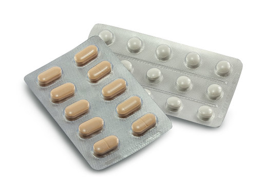 pills in the blister are isolated on a white background