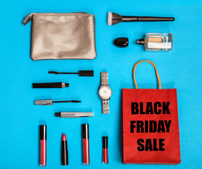 Flat lay composition with shopping bag and cosmetics on color background