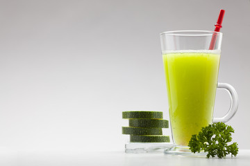 green smoothie on white background with blank space for text