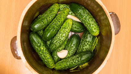 Making pickled cucumbers in clay jar