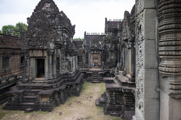 Fototapeta premium Banteay Samre ancient temple view, Angkor Wat, Cambodia. Stone carved decor on hindu temple. Cambodian landscape.