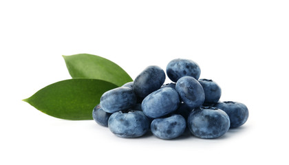 Heap of fresh ripe blueberries on white background