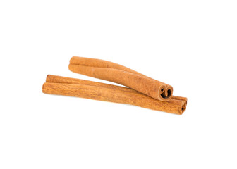 two cinnamon sticks isolated on white background