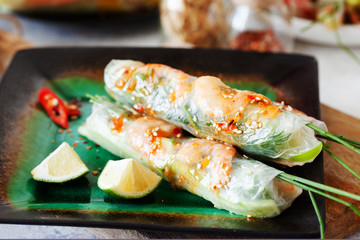 Fresh spicy vietnamese salad rolls with shrimp on a white plate