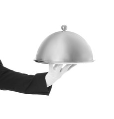Waiter holding metal tray with lid on white background, closeup