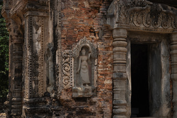Stone carved bas-relief of Preah Koh temple in Roluos complex, Cambodia. Temple entrance bas-relief restoration.