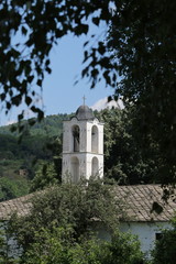 Fototapeta na wymiar The belfry of Kovachevitsa village`s church, Bulgaria