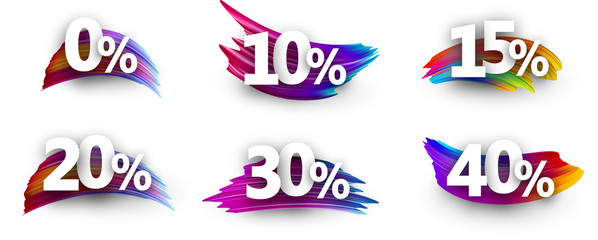 Discount tags with percent and colorful brush strokes.