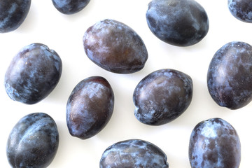 Plums on white background.