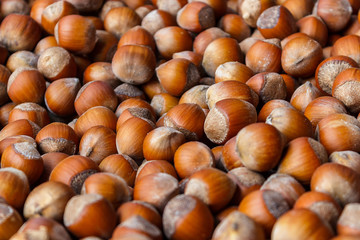 Nut background of hazelnut fruits. Food background. Top view of hazelnut nuts.