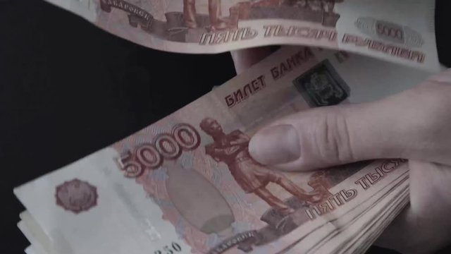 Rouble. Money. Bill 5000. Counting money.