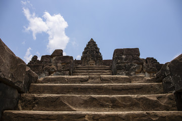 Fototapeta na wymiar Tall stone stair to ancient temple top, Bacong temple, Roluos temple complex, Cambodia. Bacong temple top view